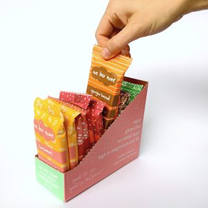 12 pack of We Bar None bars in a shelf ready display box. Victoria's first home compostable snacks.