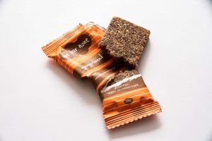 We Bar None Gingerbread bar. Home compostable wrapper torn open to reveal the bar inside.